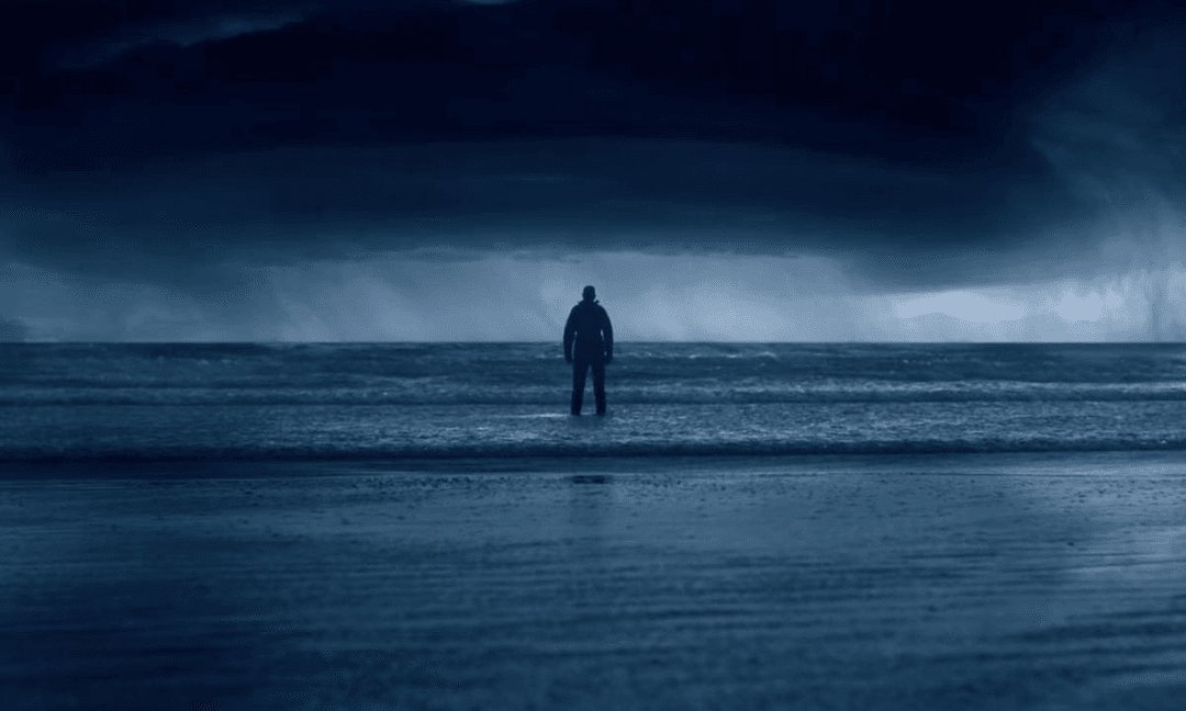 A man looking at a storm