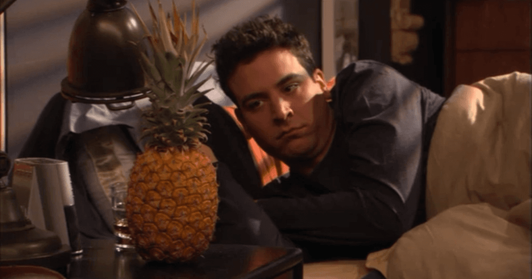 Ted looking at a pineapple in How I Met Your Mother