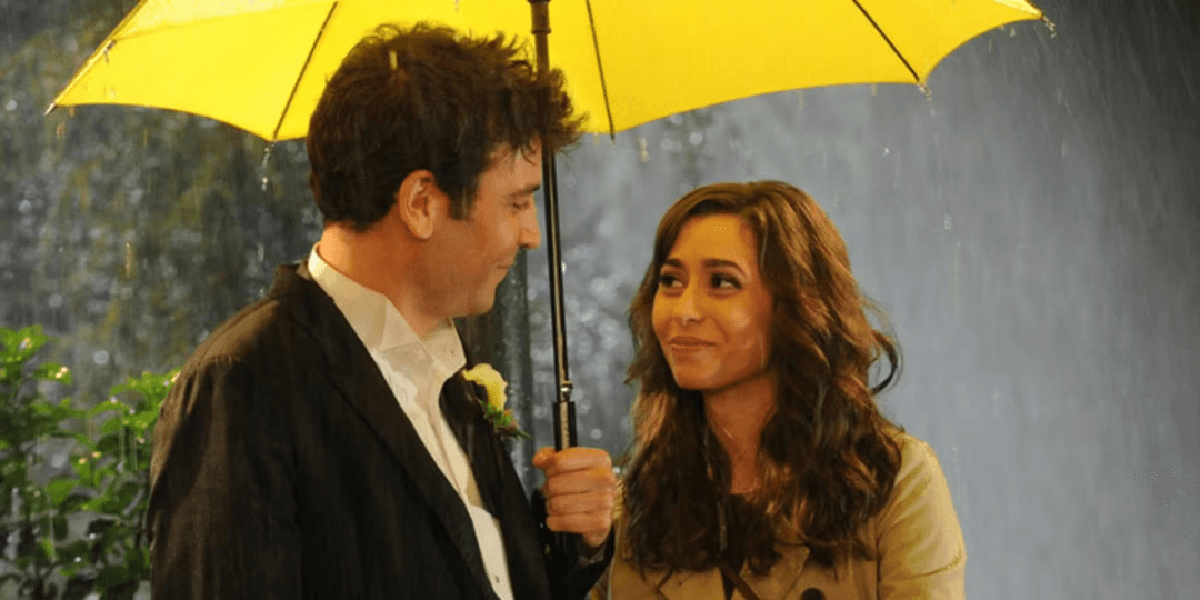 Tracy and Ted standing under a yellow umbrella in How I Met Your Mother
