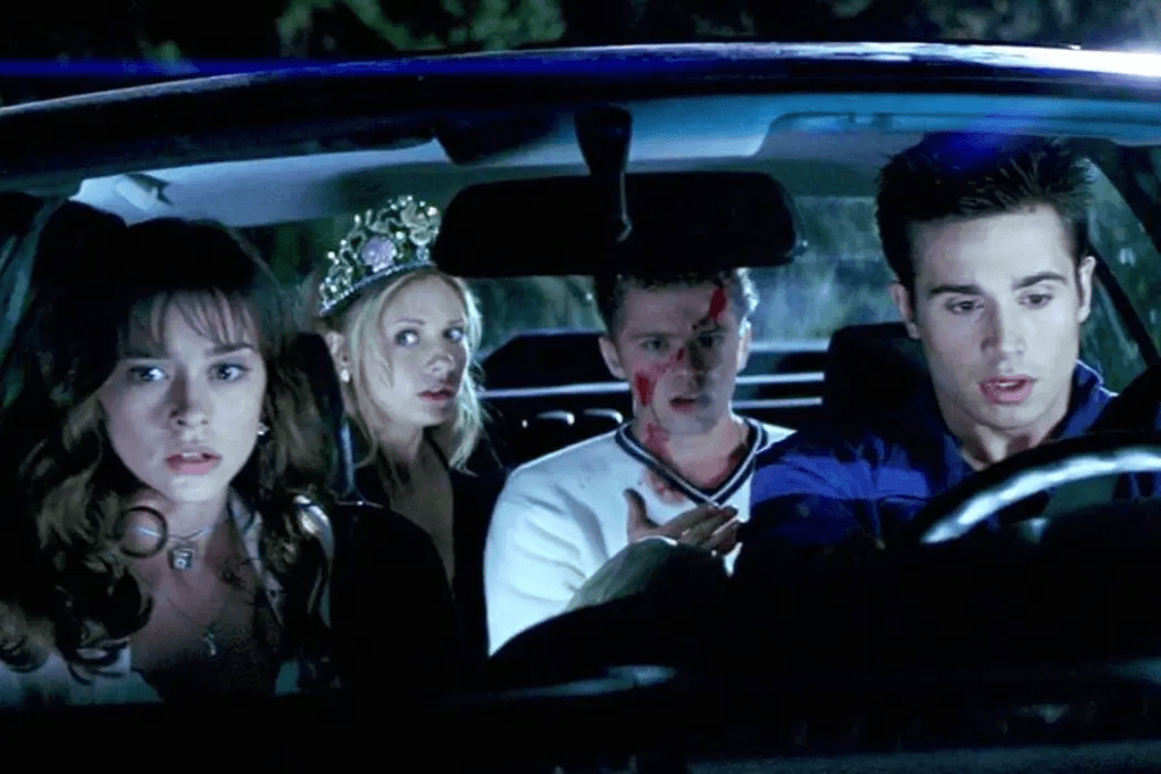 The main characters sitting in a car and looking shocked