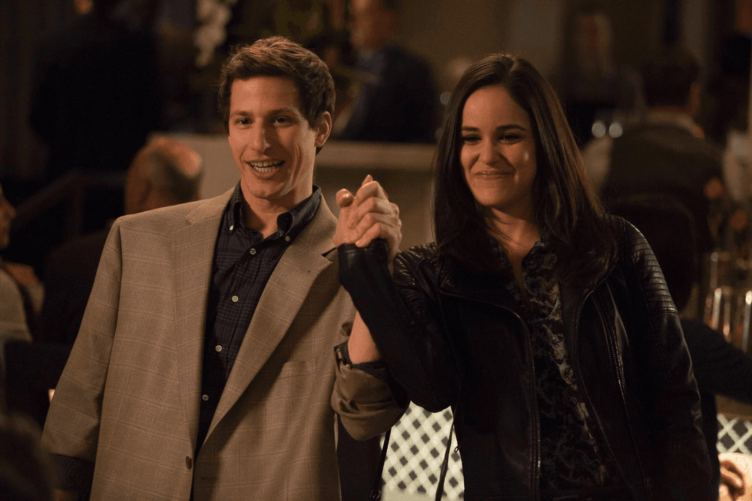 Jake and Amy holding hands and showing it proudly
