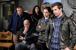 The cast of B99 standing