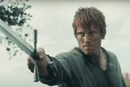 A man pointing a sword