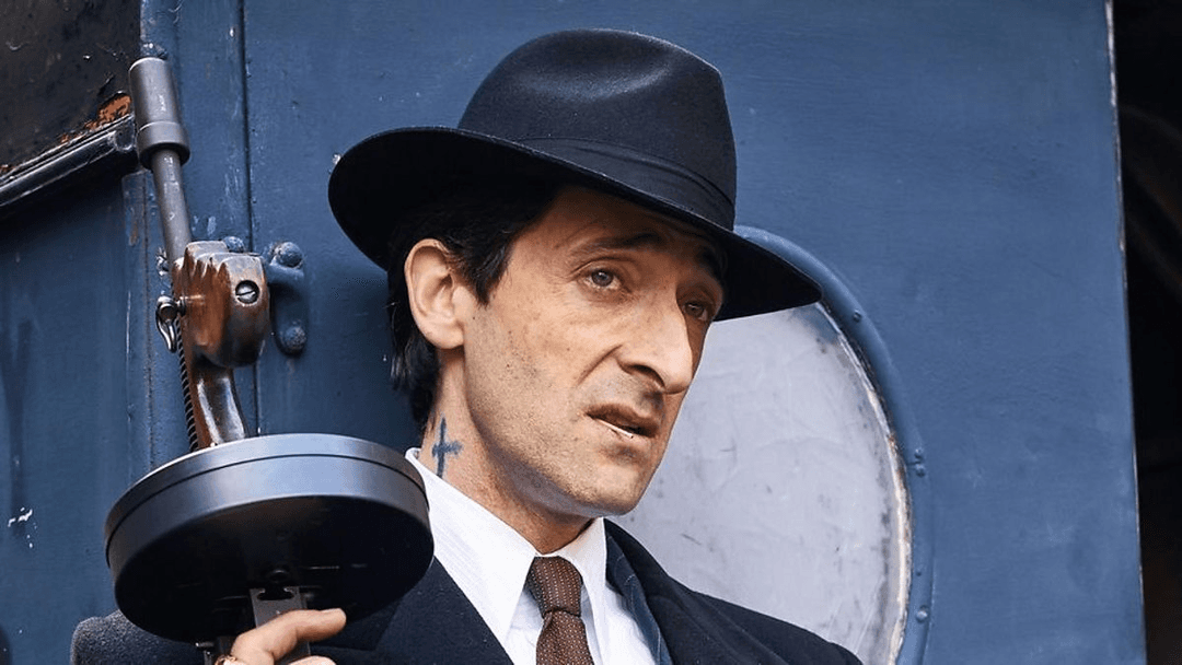 luca changretta holding something in his hand