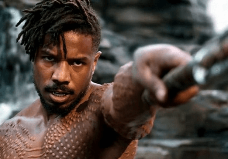 Erik Killmonger holding a weapon