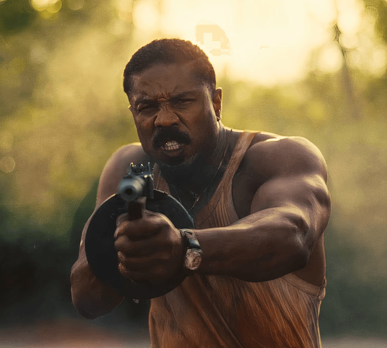 Michael B. Jordan holding a tommy gun in Sinners