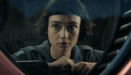 A woman looking out the window in Alien: Earth