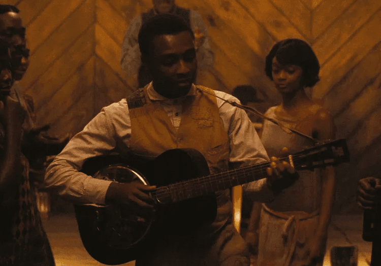 Sammie Playing Blues on a guitar