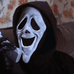 The killer holding a phone with a weird expression on his mask